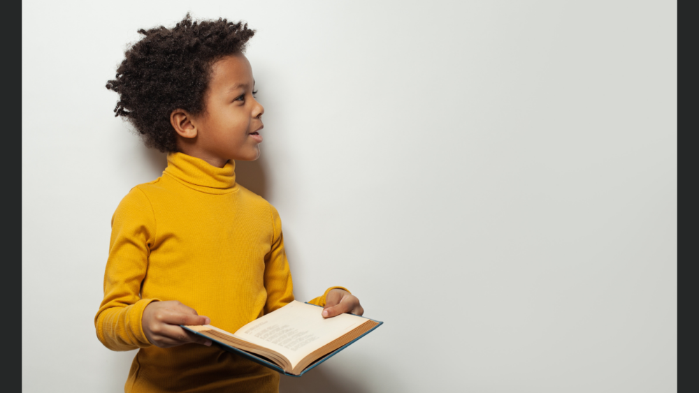 FirstSteps for kids blog what is ABA? Young boy holding open book